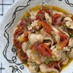 Chicken, tomatoes and thyme in olive oil