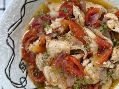 Chicken, tomatoes and thyme in olive oil