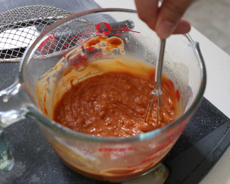 Mixing kare-kare peanut sauce