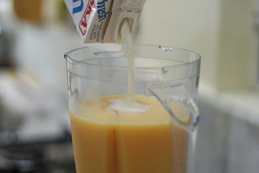 Pouring milk into blender