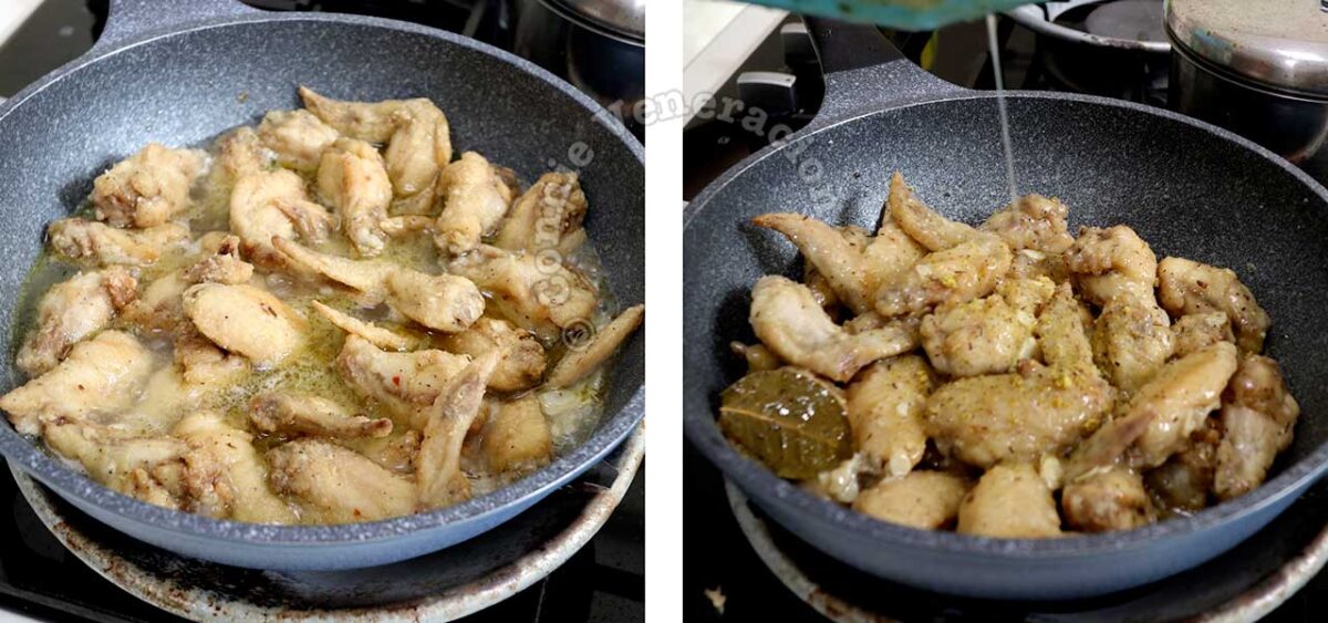 Simmering chicken in white wine, broth, garlic, thyme and bay leaves