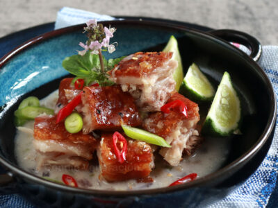 Crispy pork belly in coconut cream sauce