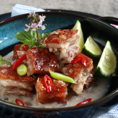 Crispy pork belly in coconut cream sauce