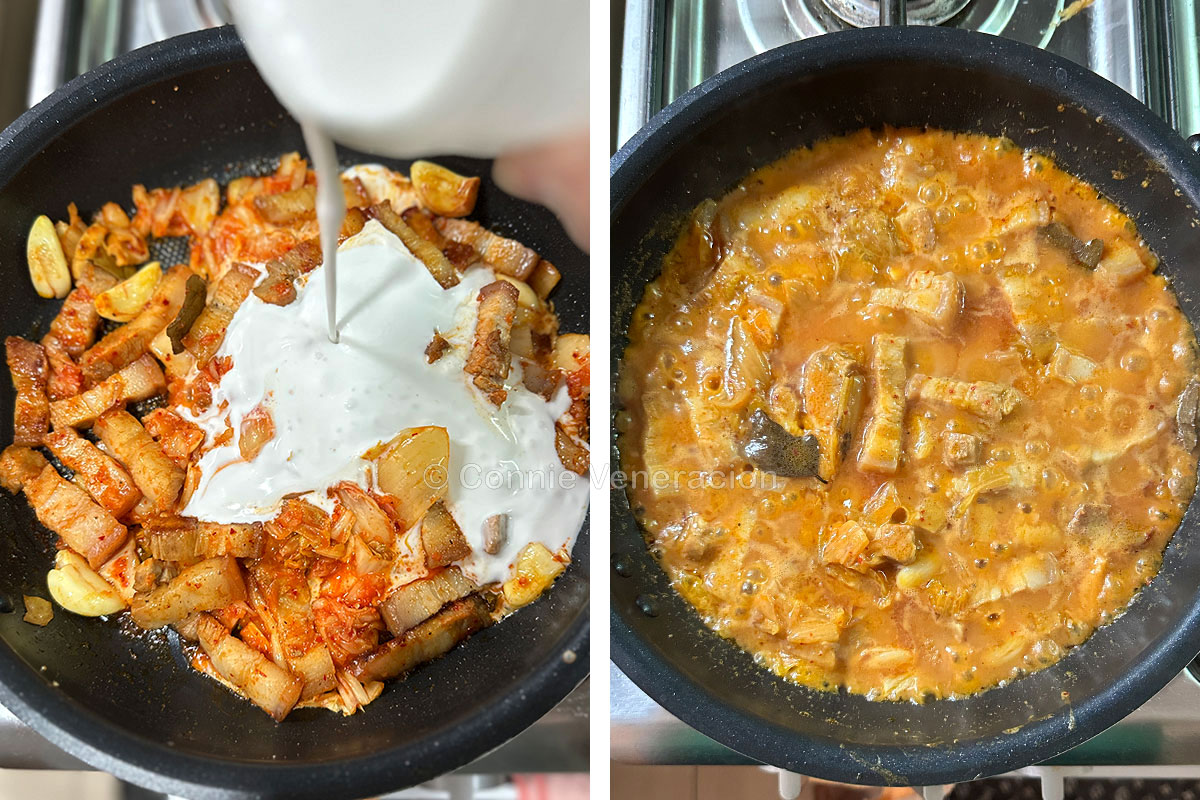 Pouring coconut cream over browned pork and kimchi in pan