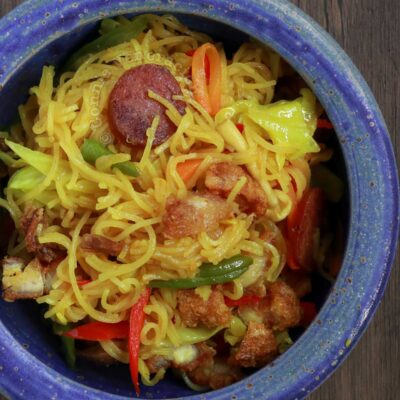 Singapore noodles (curry bee hoon) with crispy pork belly