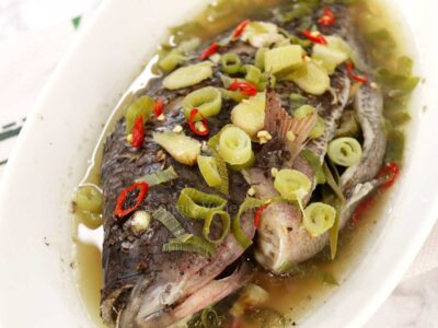 Steamed whole tilapia with ginger, chilies and scallions