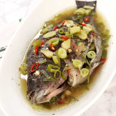 Steamed whole tilapia with ginger, chilies and scallions