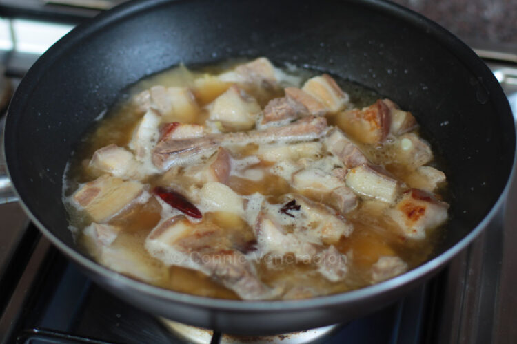 Simmering pork in broth