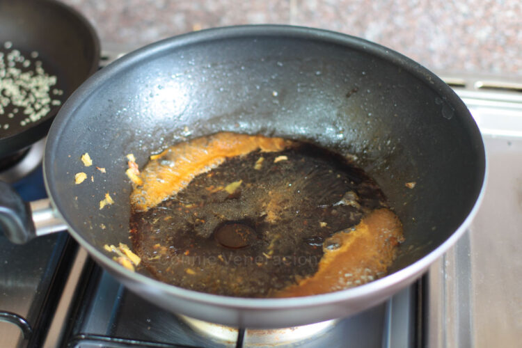 Boiling sauce until thick before tossing in cooked pork