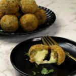 Cheese-stuffed tuna and potato balls