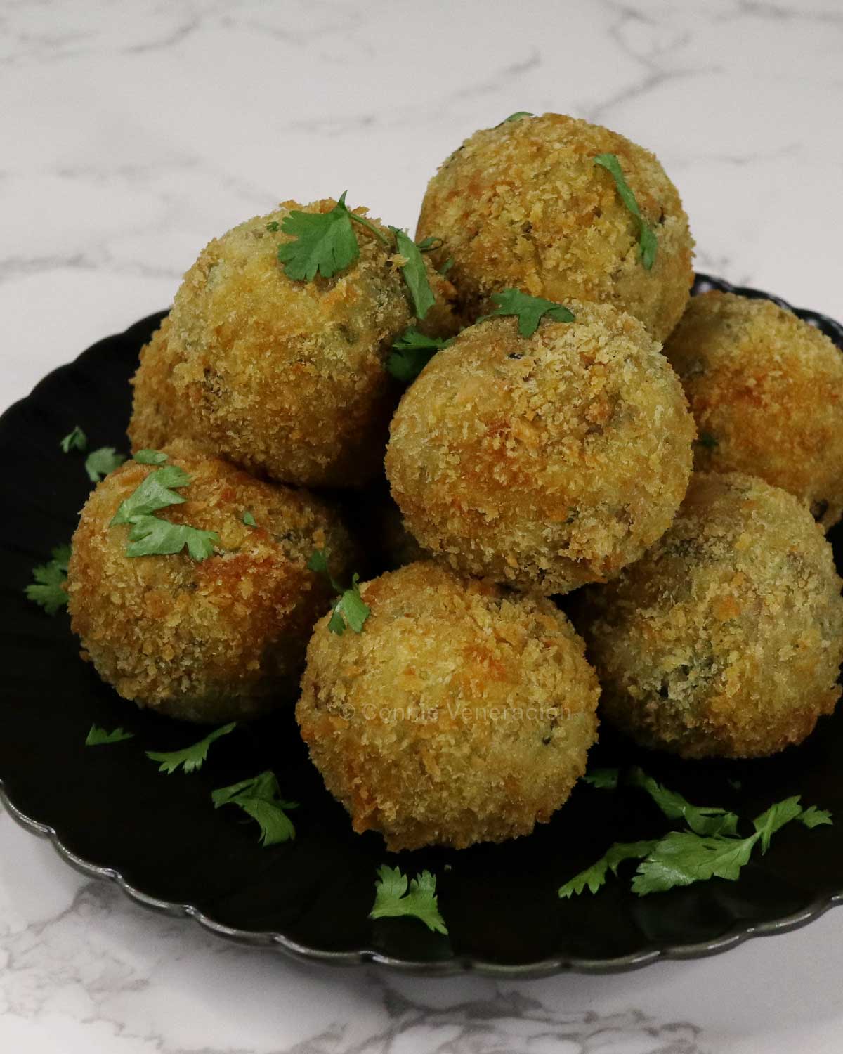 Cheese-stuffed tuna and potato balls