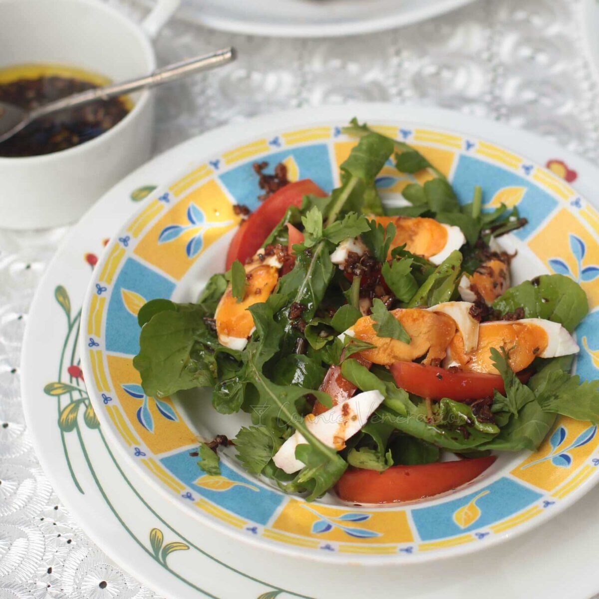 Arugula, tomato and salted duck egg salad with ginger vingaigrette