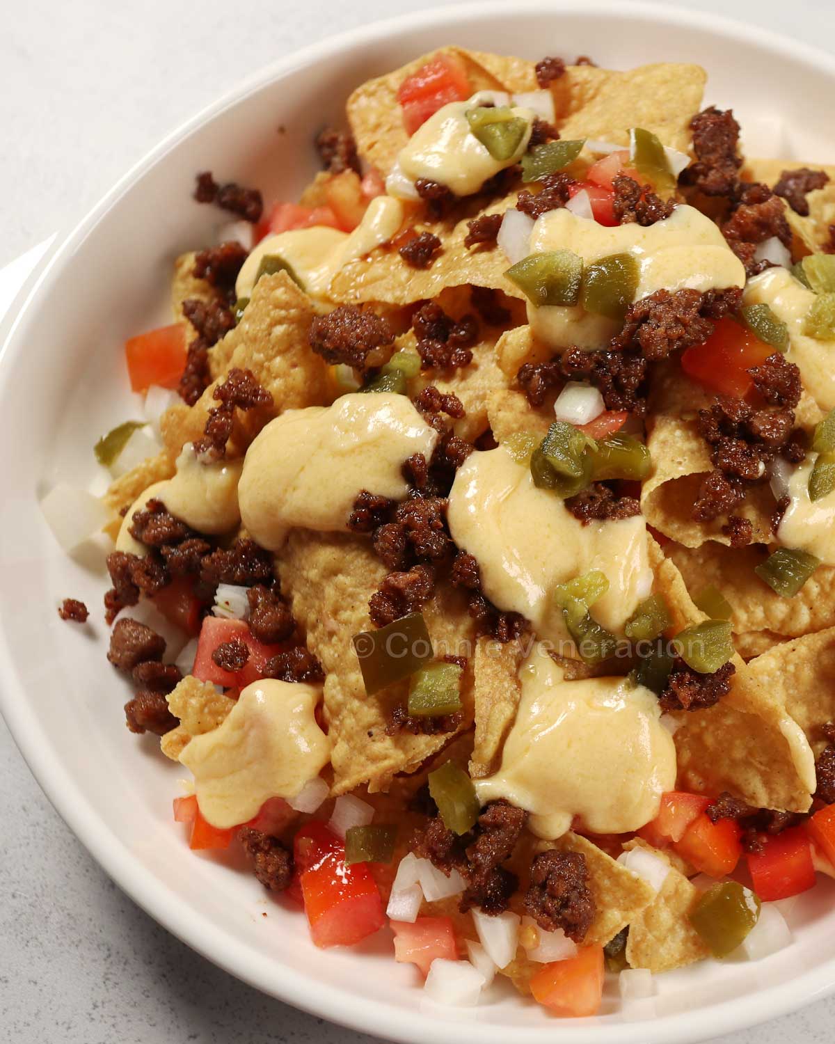 Spicy beef nachos with cheese sauce