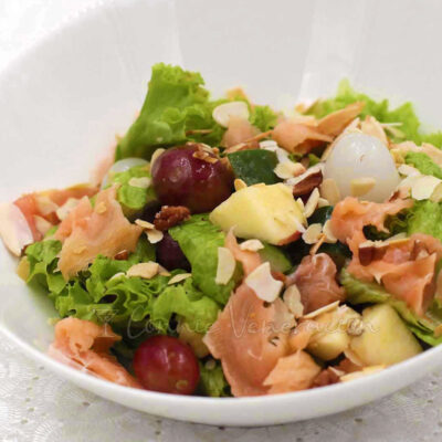 Smoked salmon salad with fruits and nuts