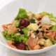 Smoked salmon salad with fruits and nuts