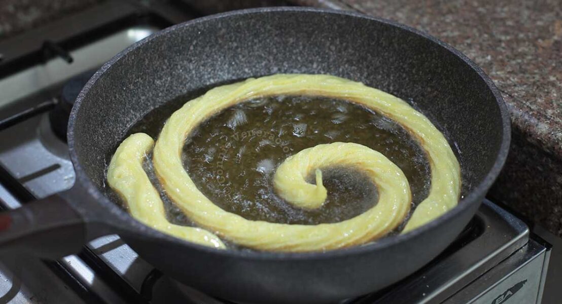 Deep frying piped choux pastry