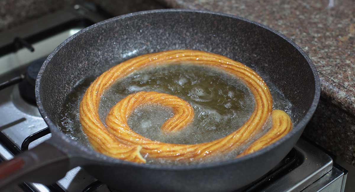 Deep frying piped choux pastry