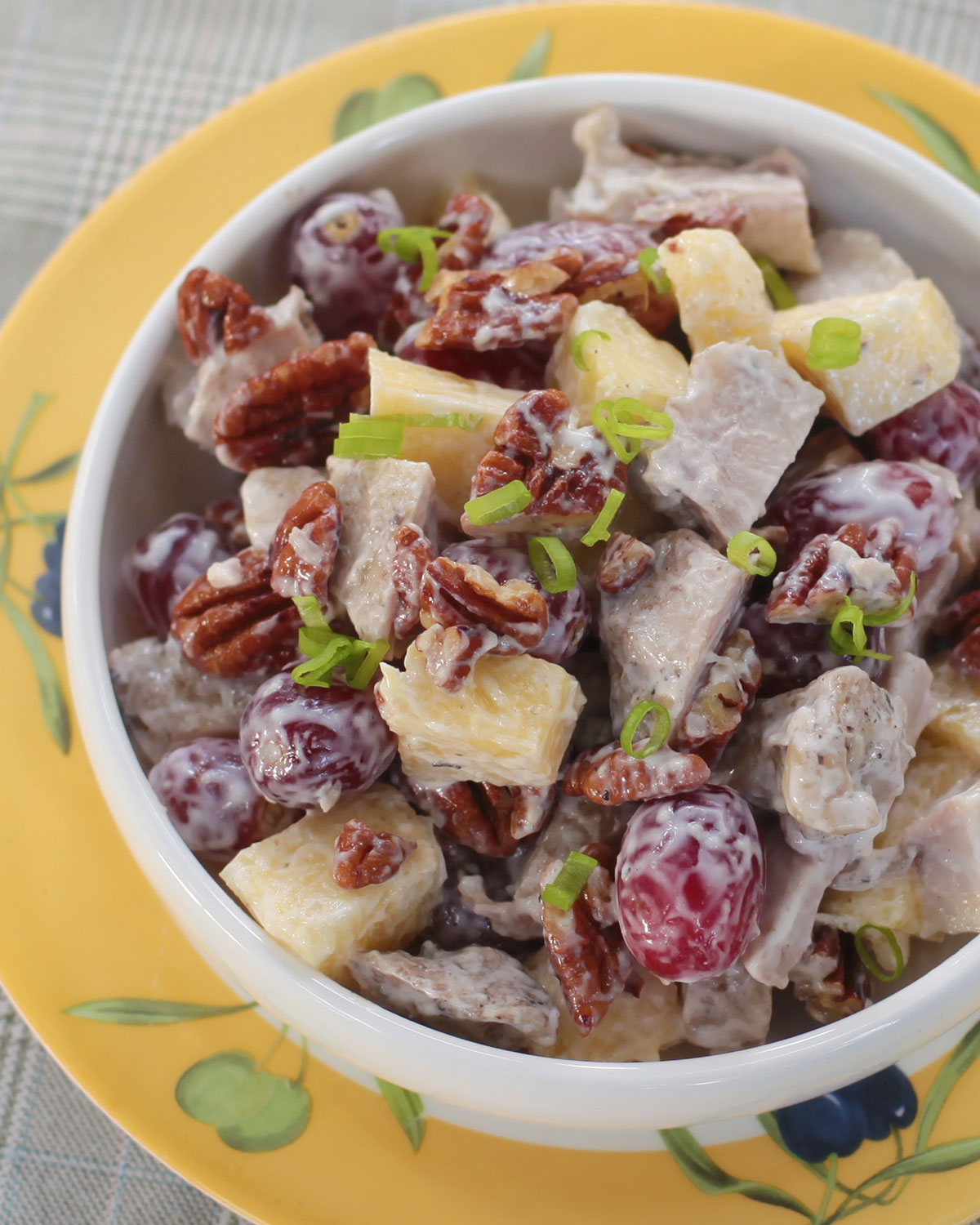 Grilled chicken salad with fruits and nuts