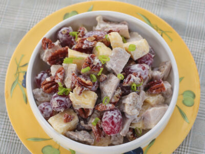 Grilled chicken salad with fruits and nuts