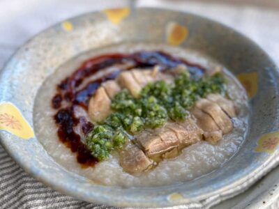 Hainese chicken congee with ginger-scallion sauce, sweet soy sauce and chili sauce