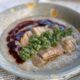 Hainese chicken congee with ginger-scallion sauce, sweet soy sauce and chili sauce