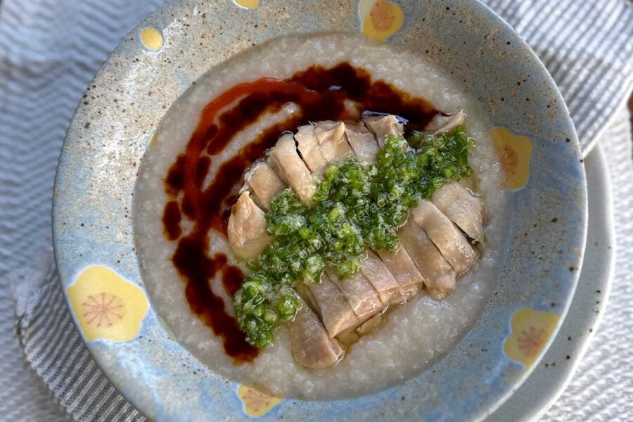 Hainese chicken congee with ginger-scallion sauce, sweet soy sauce and chili sauce