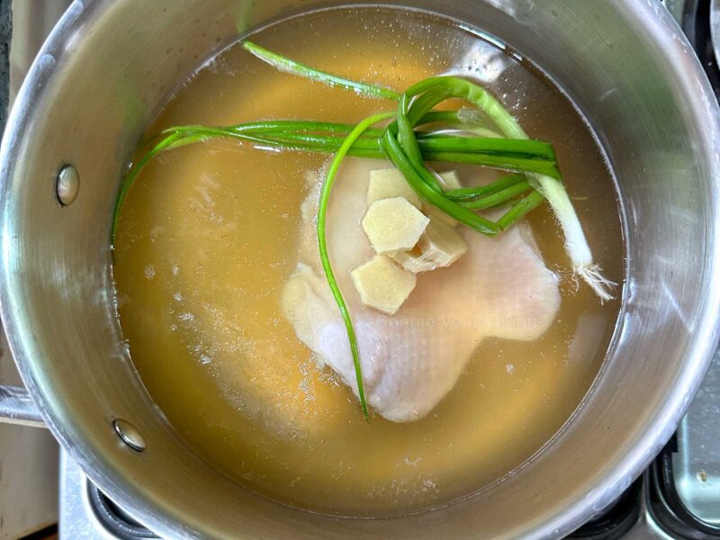 Poaching chicken thigh fillet in chicken bone broth