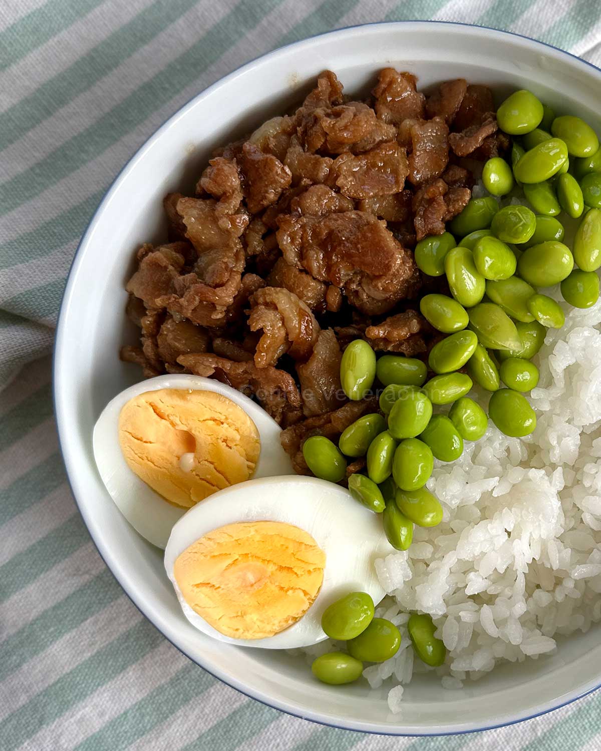 Pork version of gyudon served with edamame and hard-boiled egg
