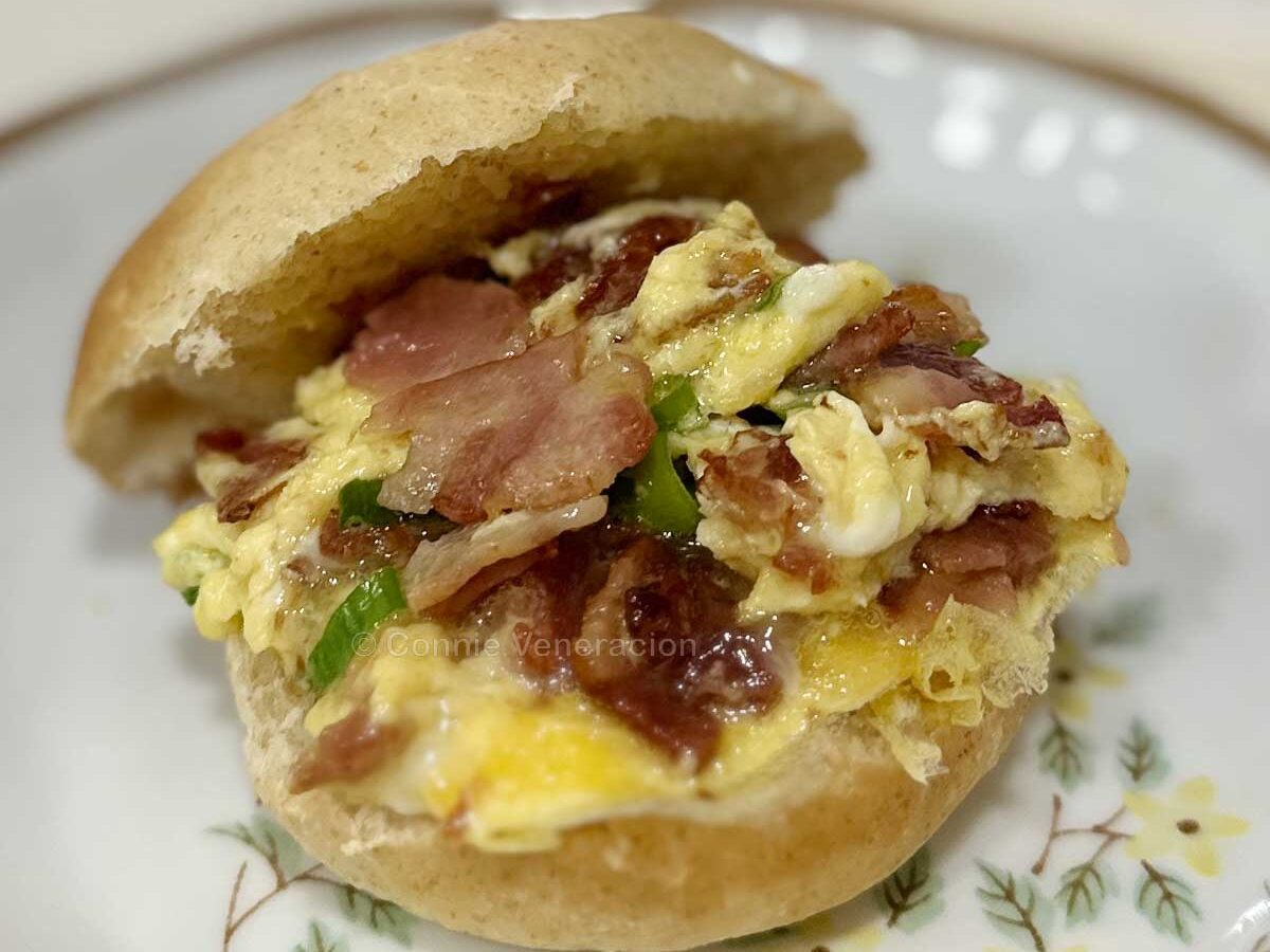 Scrambled eggs and bacon breakfast sandwich