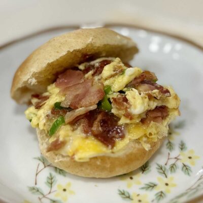 Scrambled eggs and bacon breakfast sandwich