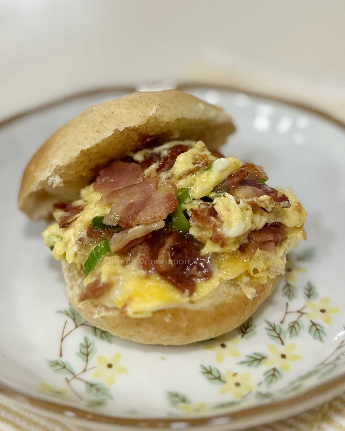 Scrambled eggs and bacon breakfast sandwich