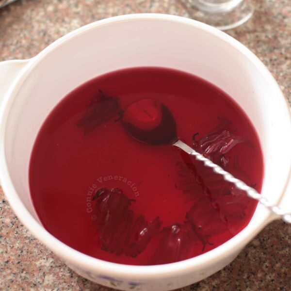 Calyces (sepals) of the roselle (Hibiscus sabdariffa) flower steeping in hot water